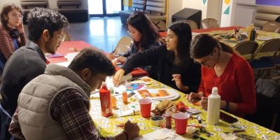 Craft & Create Session with students from Residence Life painting tote bags