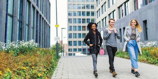 Students walking together at Central Village